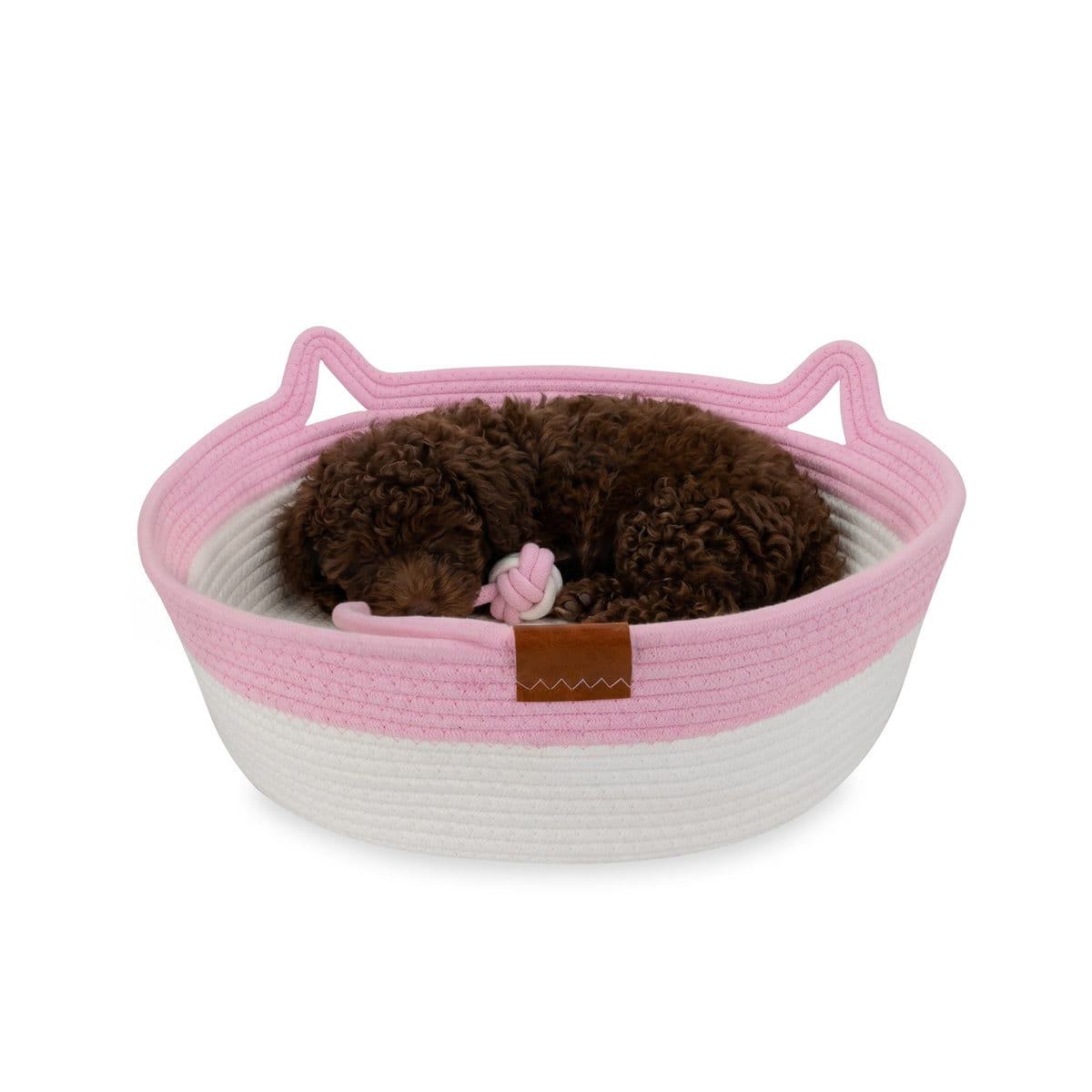 Pies odpoczywający w plecionym legowisku Carinio TAIL PLAY Pink